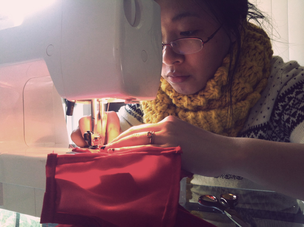 Yeok sewing little curtains for Lilly